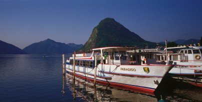 Boats on the Lugano lake in the evening