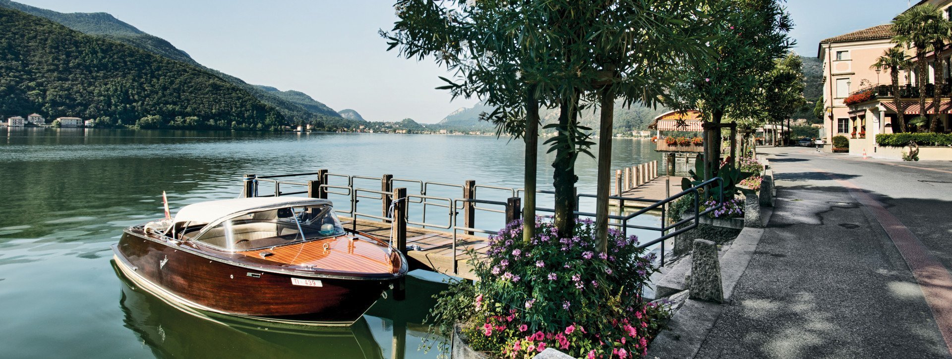 A wooden boat on the Lugano lake 