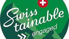 Logo circulaire vert avec texte blanc et croix rouge symbole de la Suisse