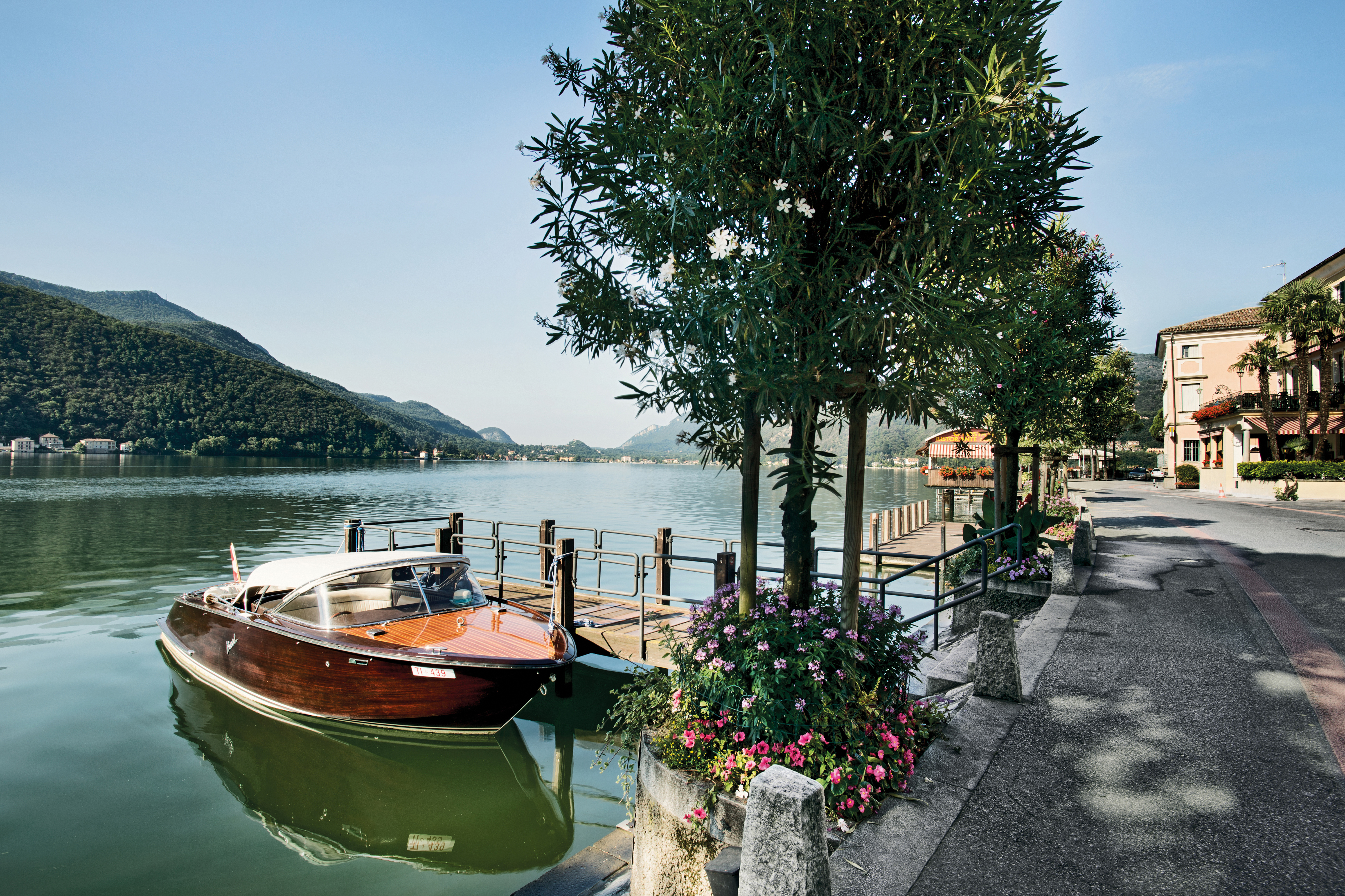 A wooden boat on the Lugano lake 