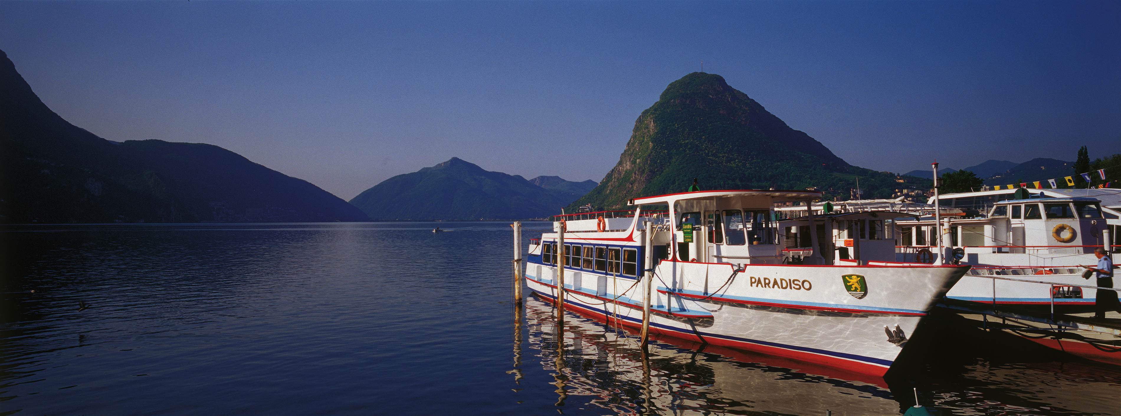 Boats on the Lugano lake in the evening