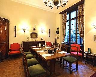 Interior of a dining room with table and chairs.
