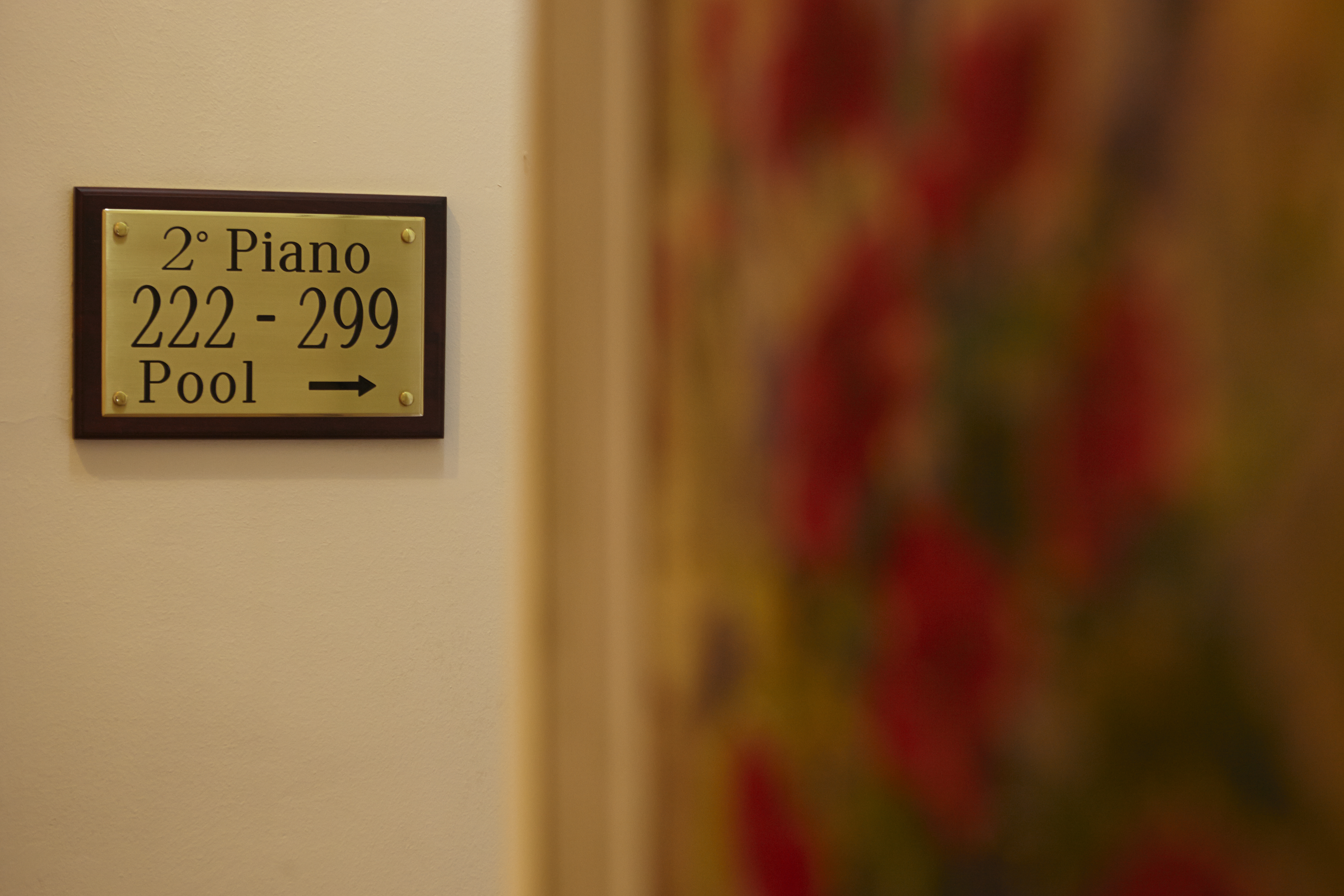 Golden floor sign in International au Lac Historic Lakeside Hotel