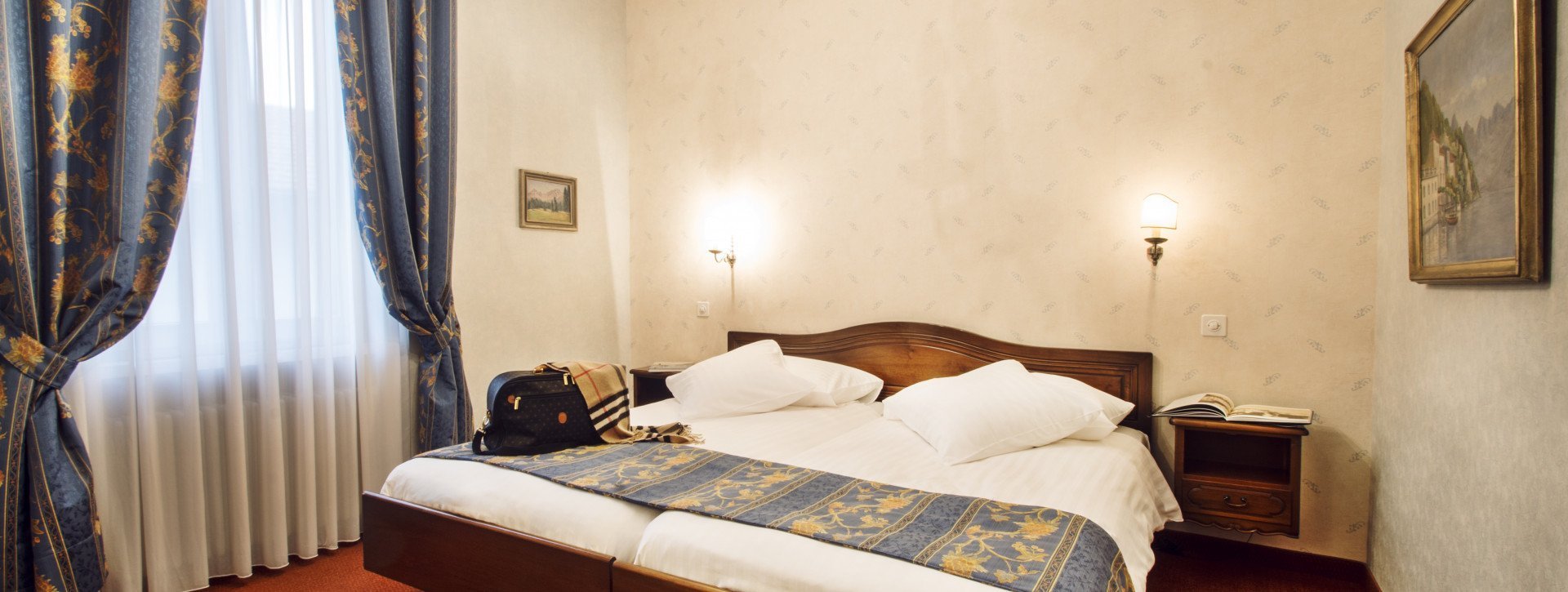 Double bed with a flat screen on the wall