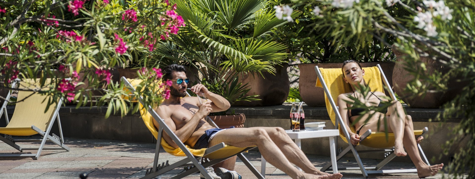 A couple is chilling out at the hotel pool