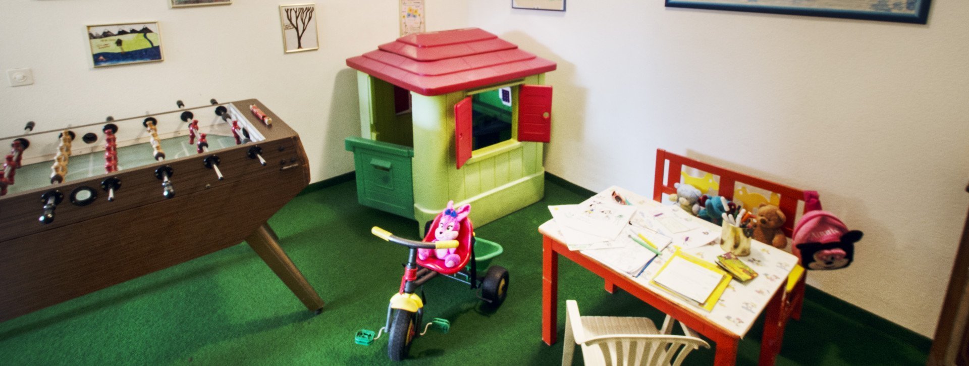 A room for kids with a soccer table