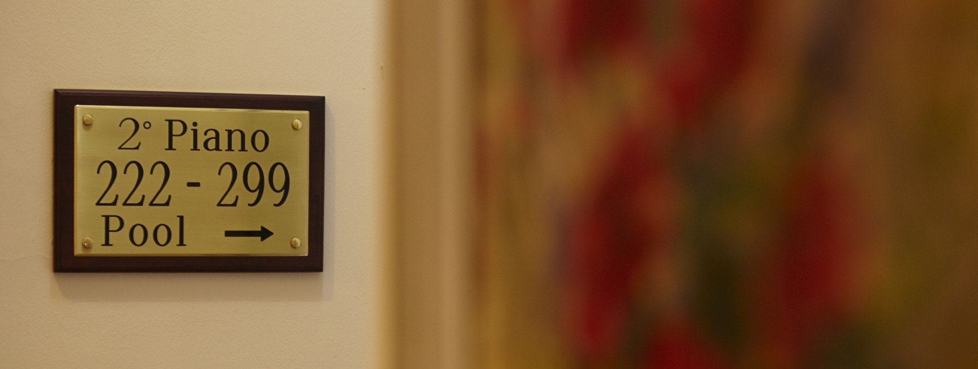 Golden floor sign in International au Lac Historic Lakeside Hotel